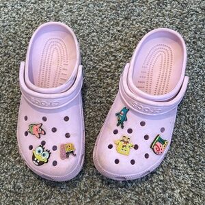Pink crocs with charms